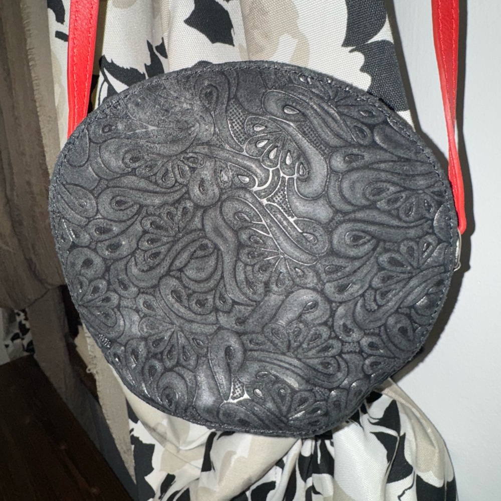 Black and Red Cross body small bag. Can be worn on shoulder as well.